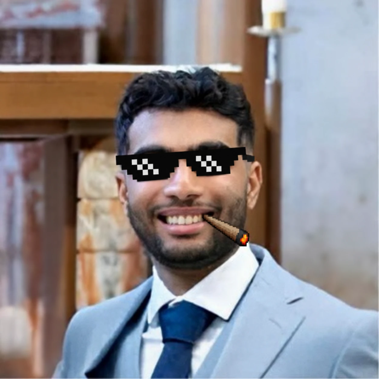 Tony wearing pixelated deal-with-it sunglasses with a blunt at the corner of his smile.